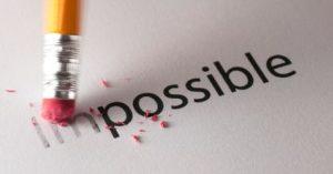 Eraser removing the “im” from “impossible,” turning it into “possible,” symbolising overcoming self-doubt and achieving success.